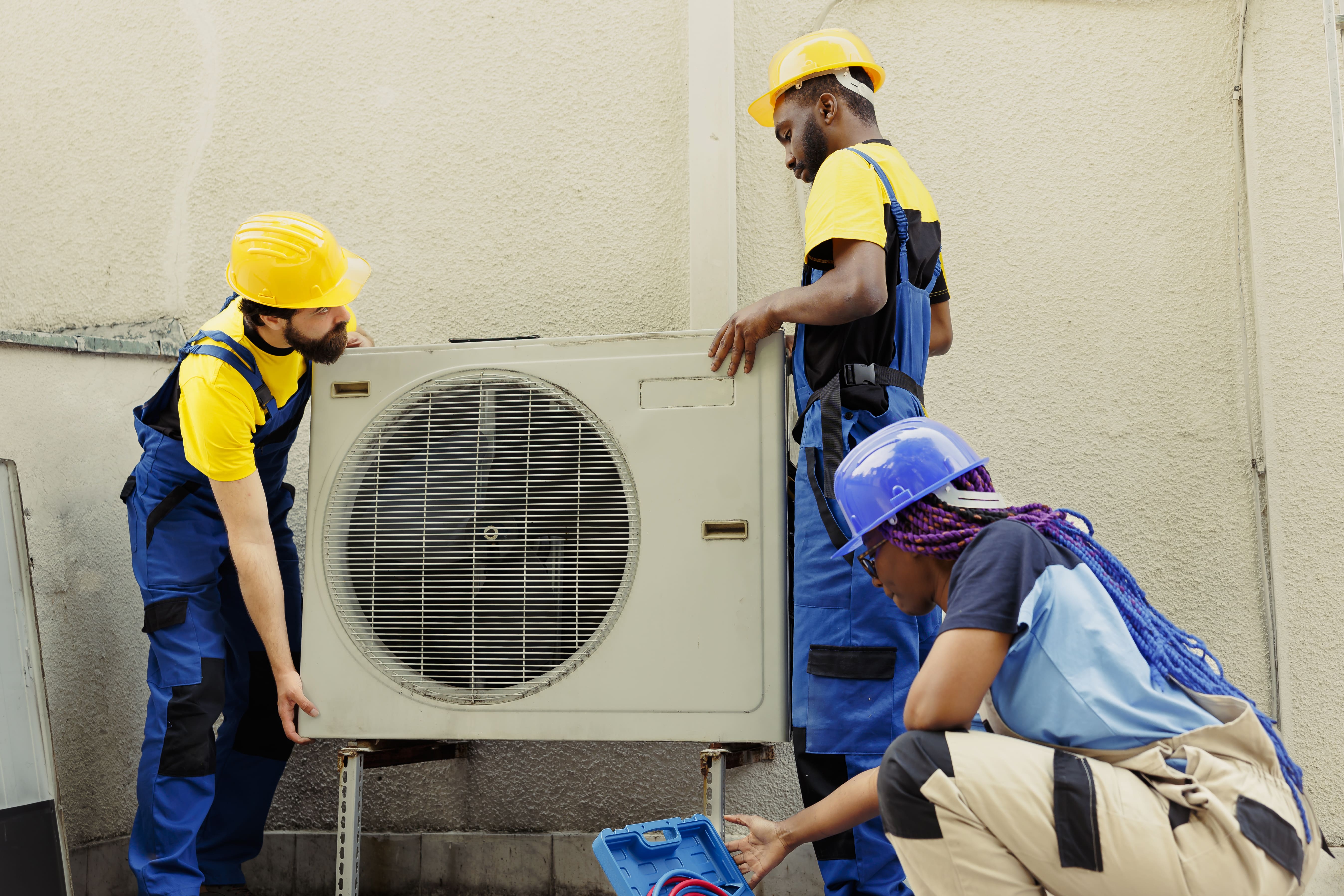 Professional aircon technician at work