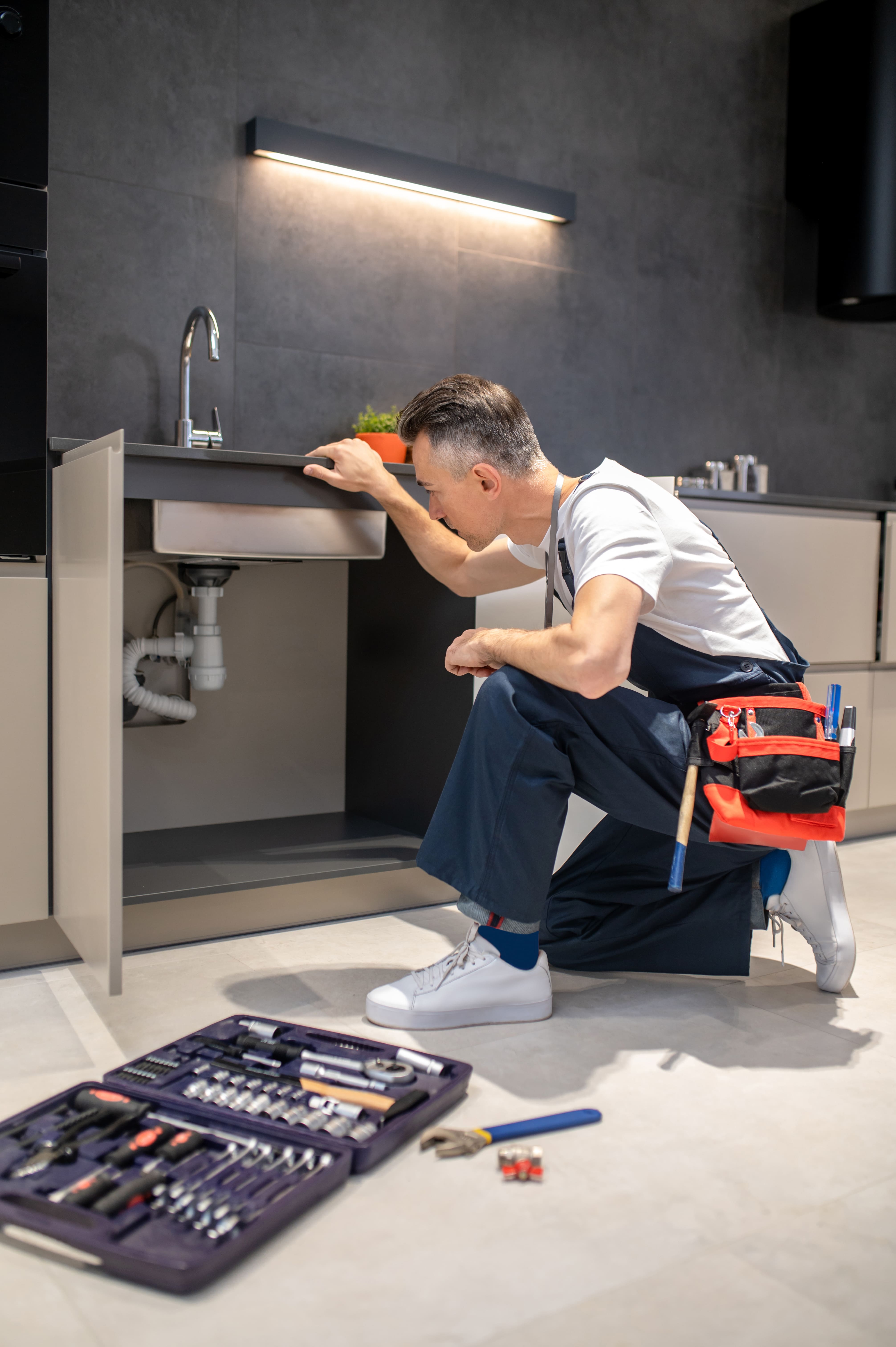 Professional plumber at work